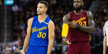 CLEVELAND, OH - DECEMBER 25: Stephen Curry #30 of the Golden State Warriors and LeBron James #23 of the Cleveland Cavaliers pause on the court during the first half at Quicken Loans Arena on December 25, 2016 in Cleveland, Ohio.